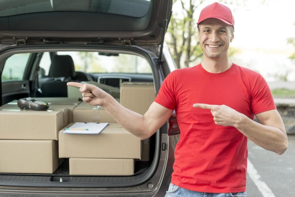 Delivery driver with packages in car trunk